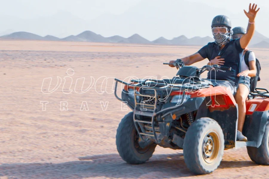 Rider enjoying a Hurghada 3 hours morning quad safari through the desert dunes